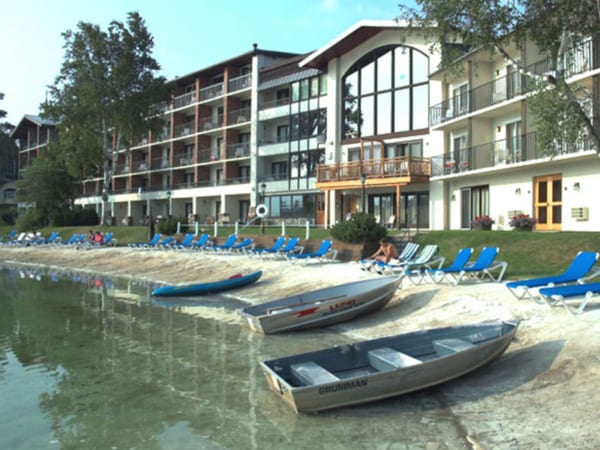 golden-cta Golden Arrow beach with lawn chairs and boats
