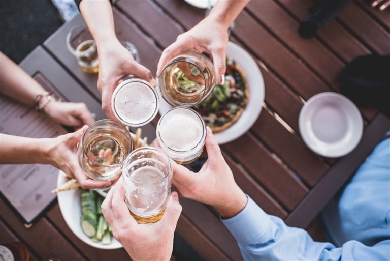 5 beer glasses cheersing
