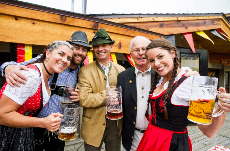 friends in German outfits celebrating Oktoberfest
