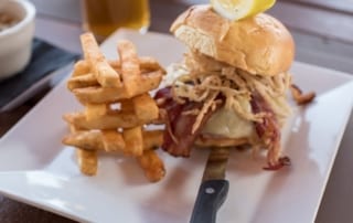 burger with bacon and crispy onions, plus a side of fries