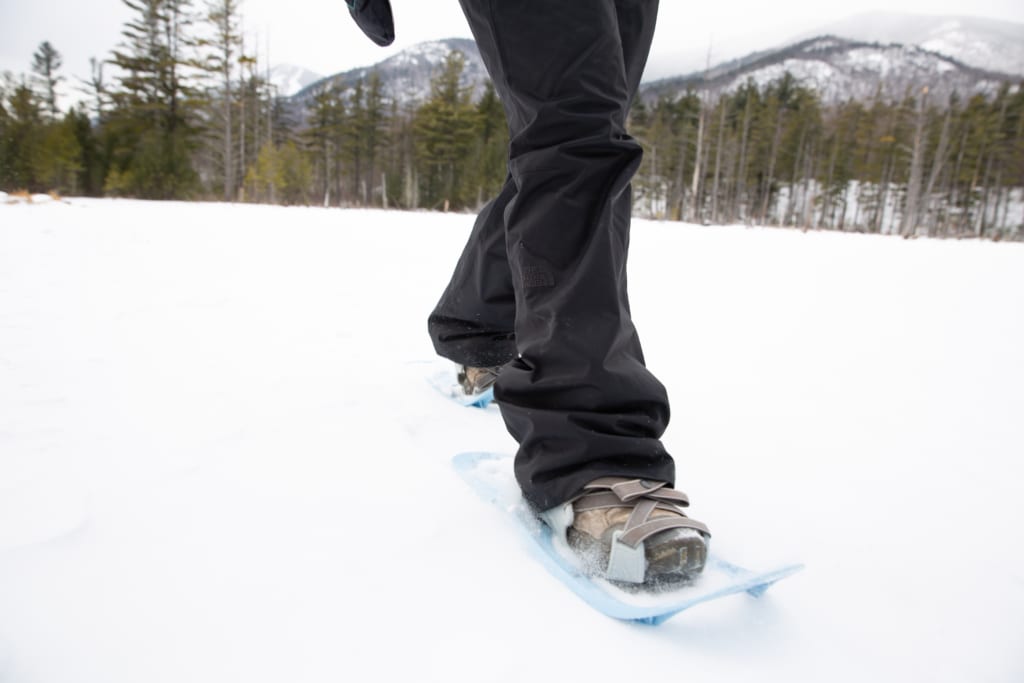 close up of person using modern snowshoes