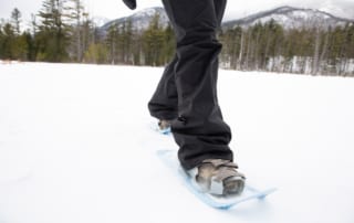 close up of person using modern snowshoes