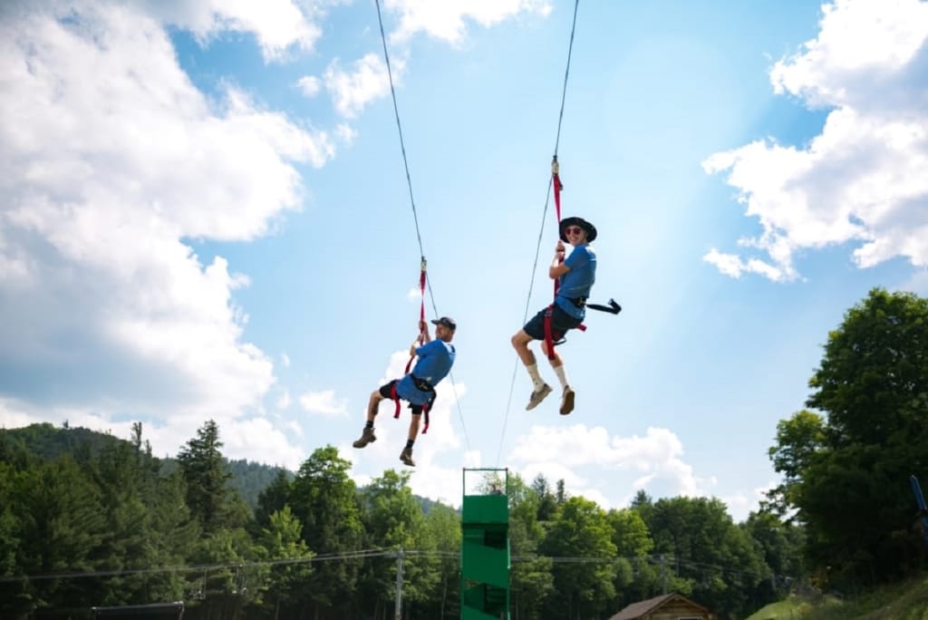 two people ziplining