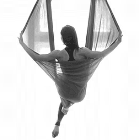 Woman in aerial hammock