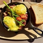 Main St Skillet: hash topped with poached eggs, hollandaise, and asparagus all served in a cast iron skillet