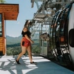 Woman walking onto Skyride Gondola