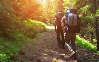 Two avid adventures test their endurance on a rugged Lake Placid hiking trail.
