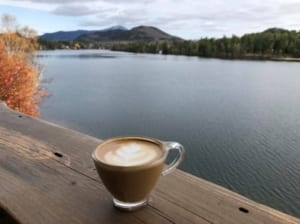 coffee mug on a railing overlooking Mirror Lake