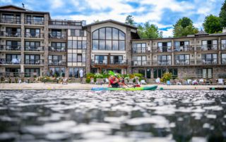 guy kayaking in mirror lake in front of golden arrow