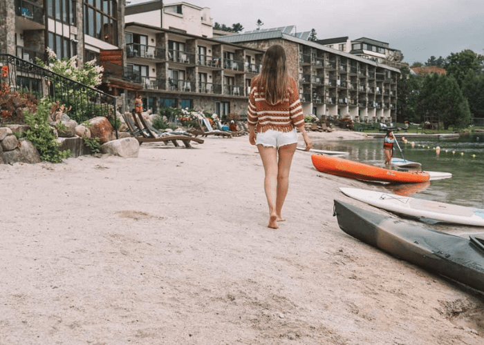 woman walking on the beach at the Golden Arrow