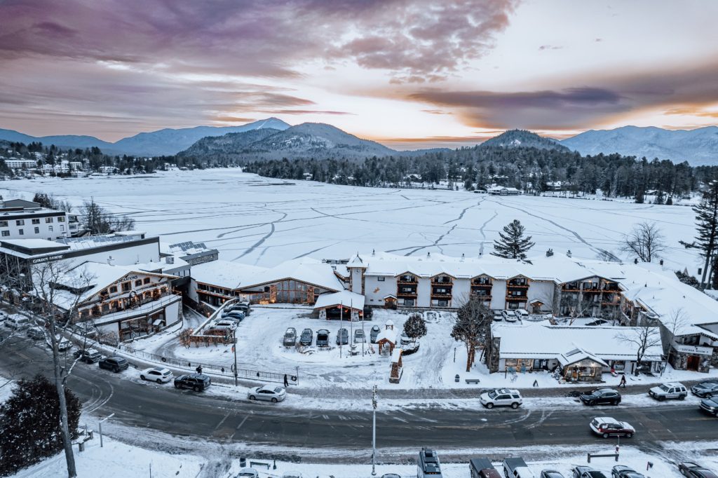 Golden Arrow Lakeside Resort overlooks a frozen Mirror Lake and the Adirondack Mountains