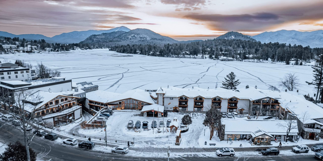Panoramic view of Golden Arrow resort and Mirror Lake during winter