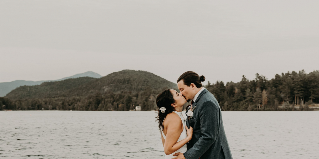 couple kissing on the dock